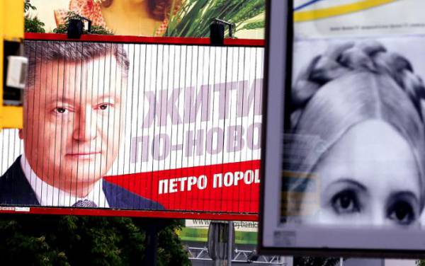 Предвыборные плакаты кандидатов в президенты Украины Петра Порошенко и Юлии Тимошенко. 2014 г